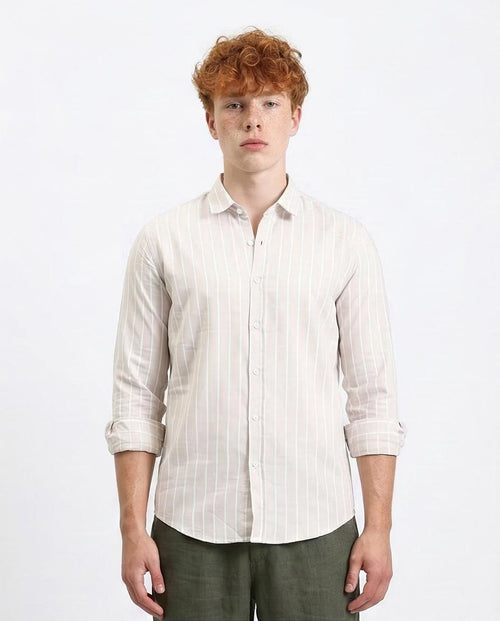 Man wearing a white striped shirt on a white background