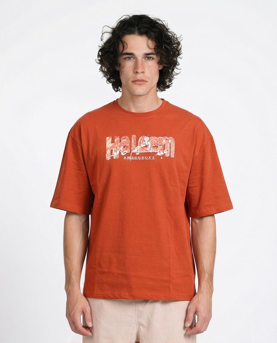 Man wearing an orange t-shirt with a logo on a white background