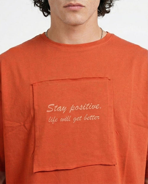 تيشيرت رافين "Stay Positive" واسع - برتقالي محروق - R207071