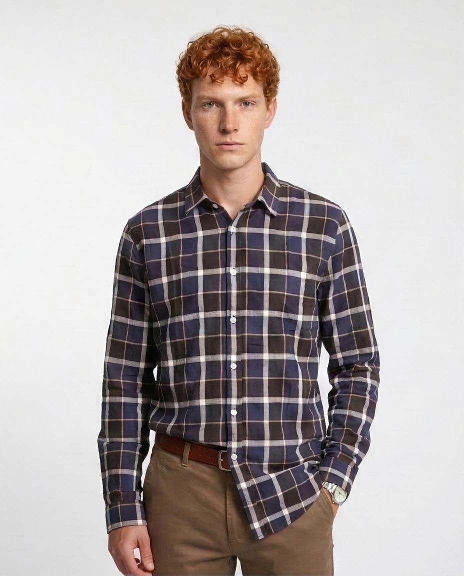 Man wearing a plaid shirt on a white background