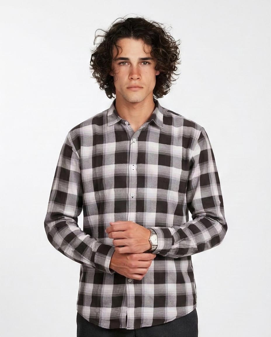 Man wearing a black and white checkered shirt on a white background