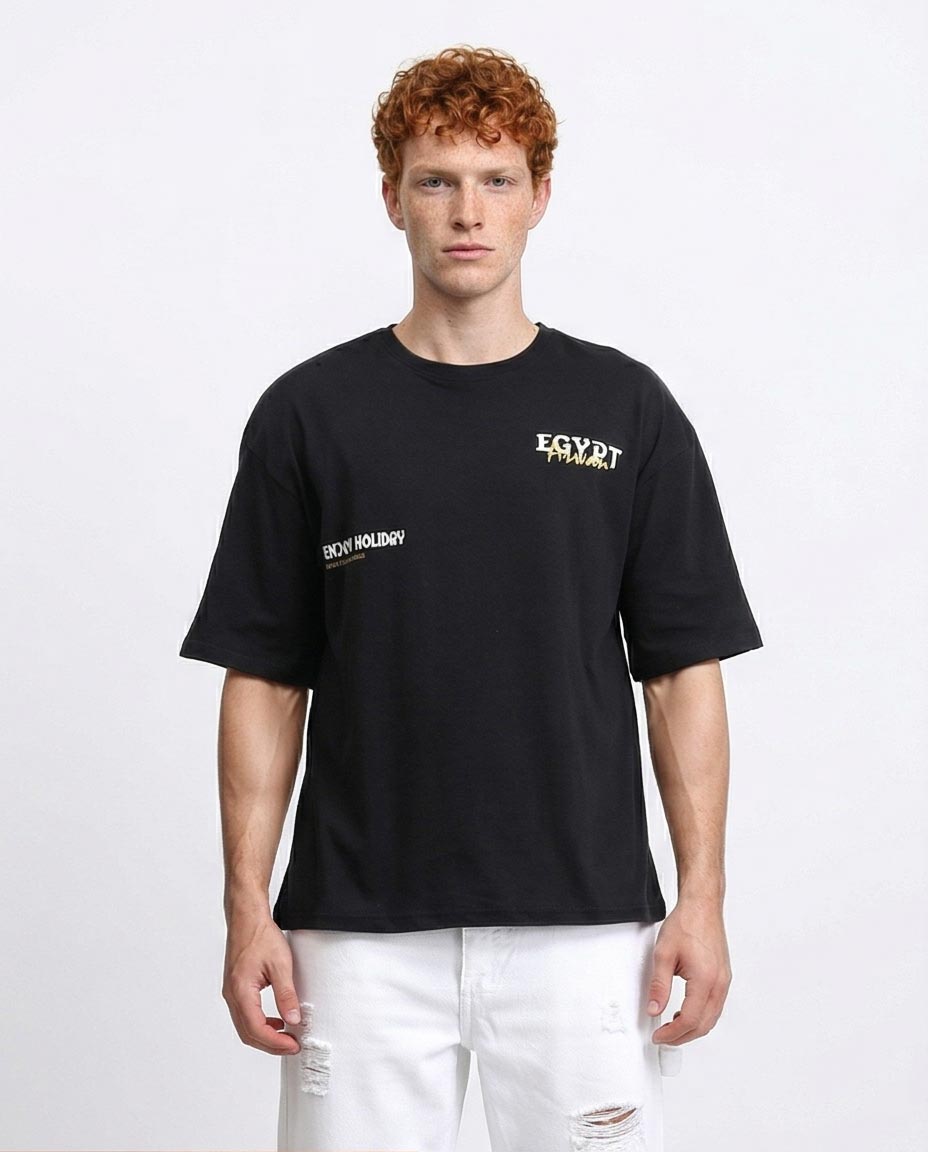 Man wearing a black t-shirt with text on a white background