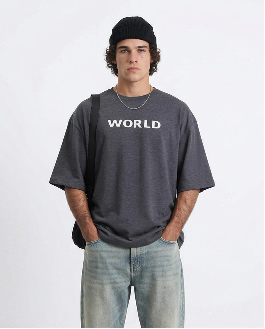 Person wearing a gray 'WORLD' t-shirt on a white background