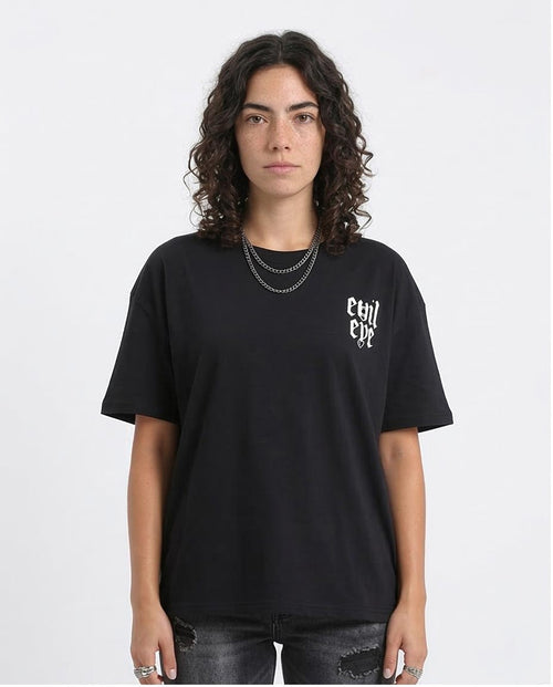 Person wearing a black t-shirt with white text on a plain background