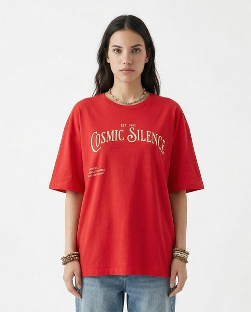 Woman wearing a red 'Cosmic Silence' t-shirt on a white background