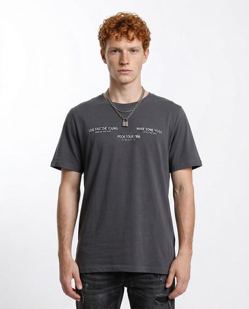 Man wearing a dark gray t-shirt with text on a white background