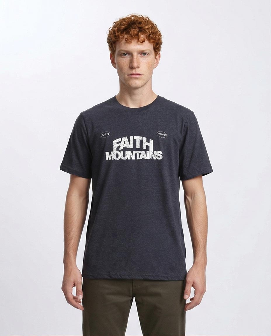 Man wearing a black t-shirt with 'Faith Mountains' text on a white background