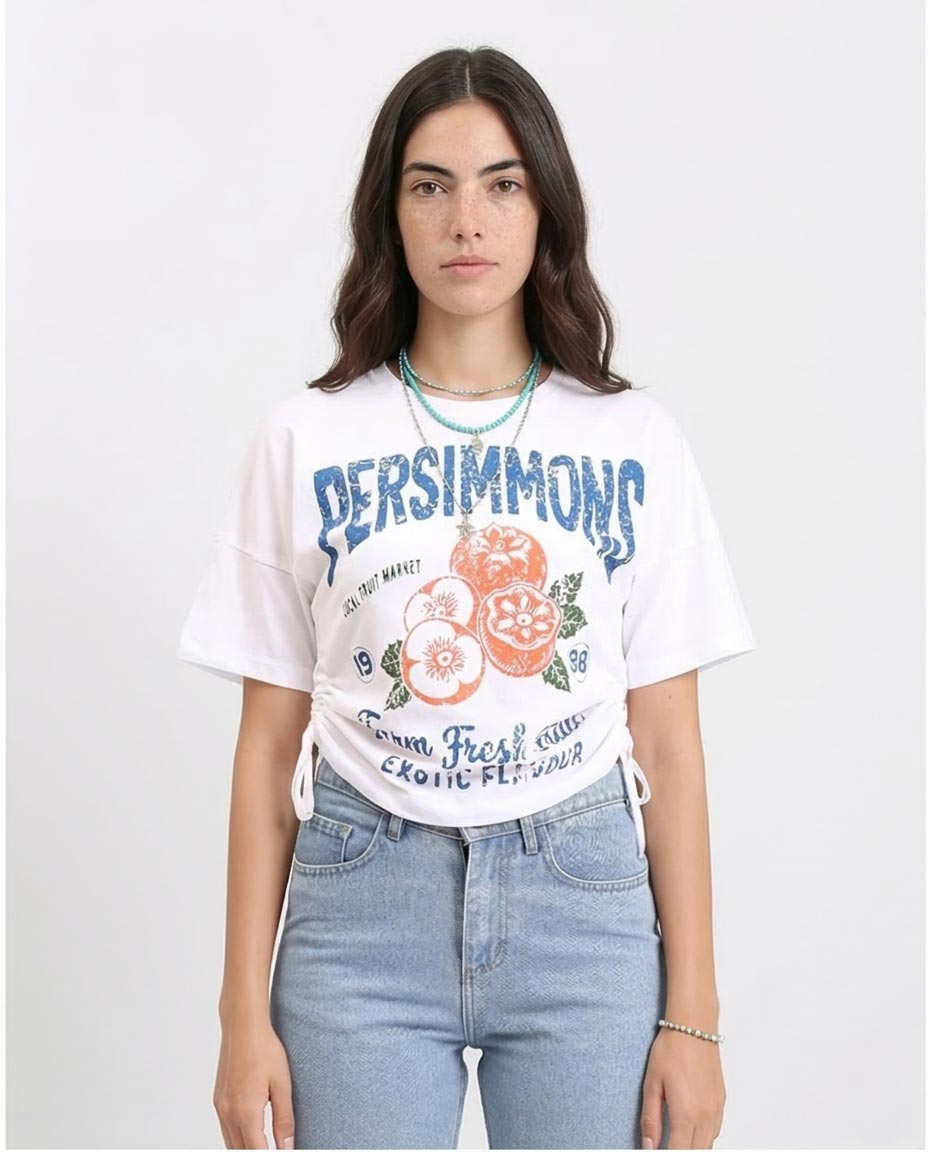 Woman wearing a white t-shirt with 'Persimmons' graphic design on a plain background