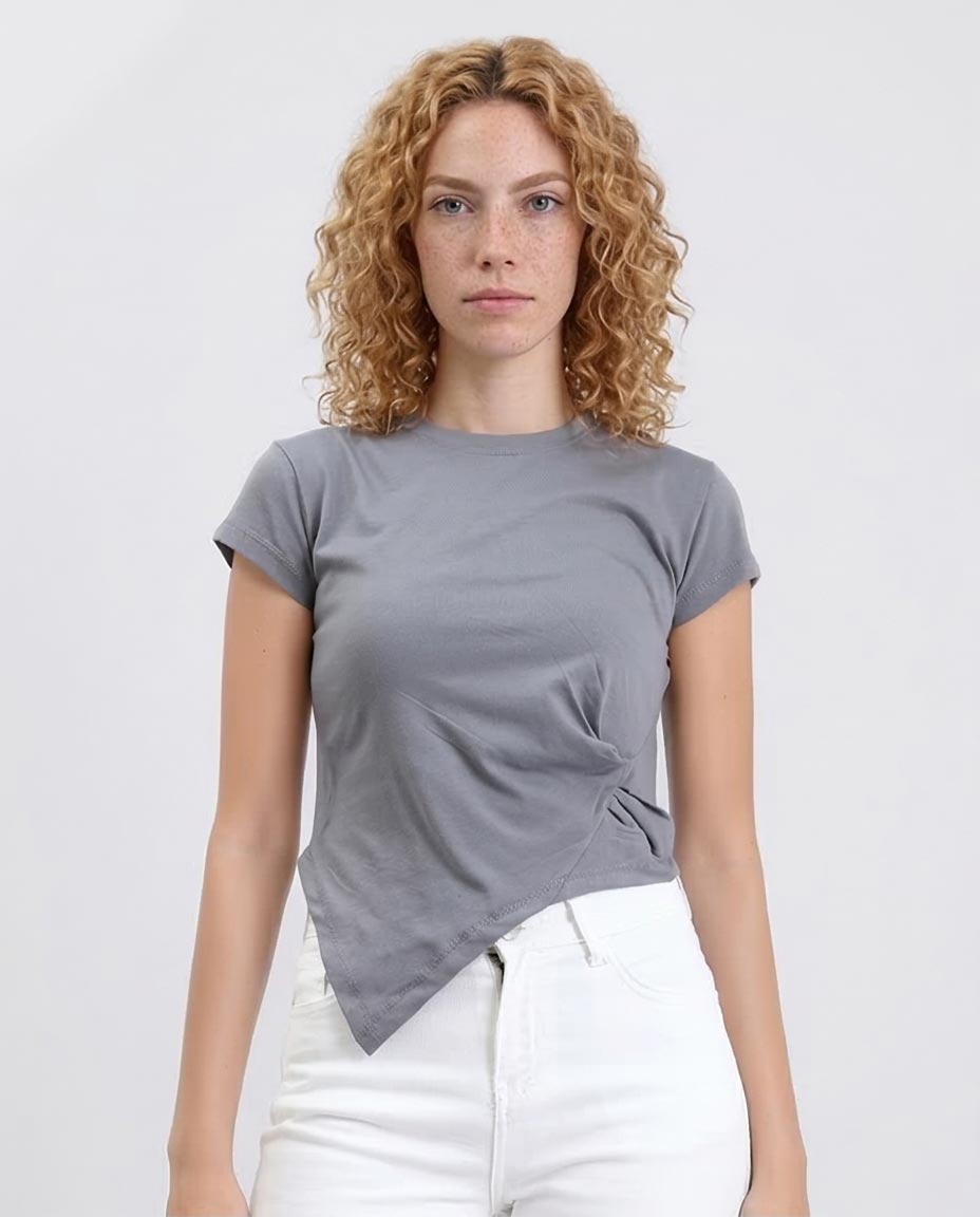 Woman wearing a gray t-shirt with a knot detail on a white background