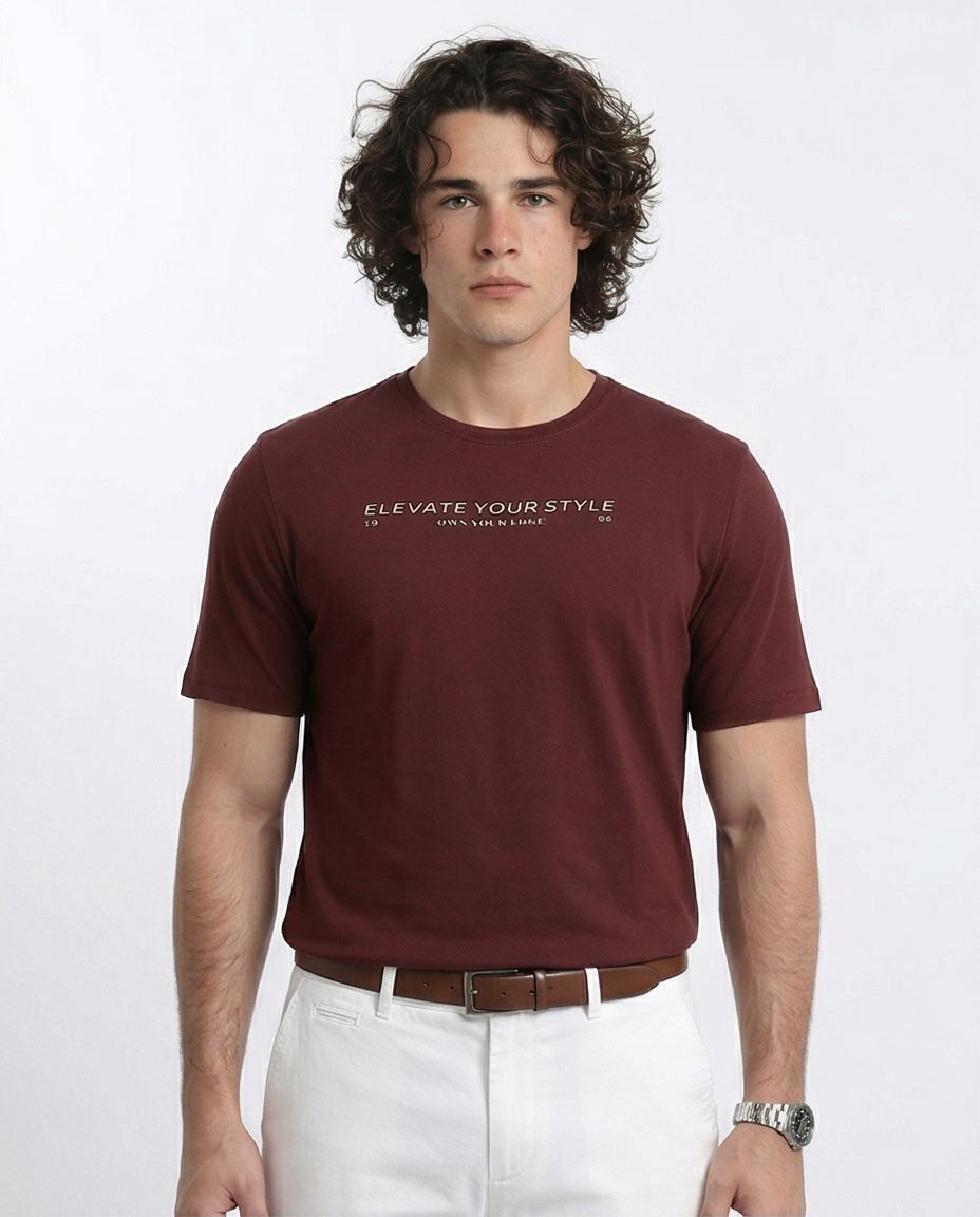 Man wearing a maroon t-shirt with text on a white background