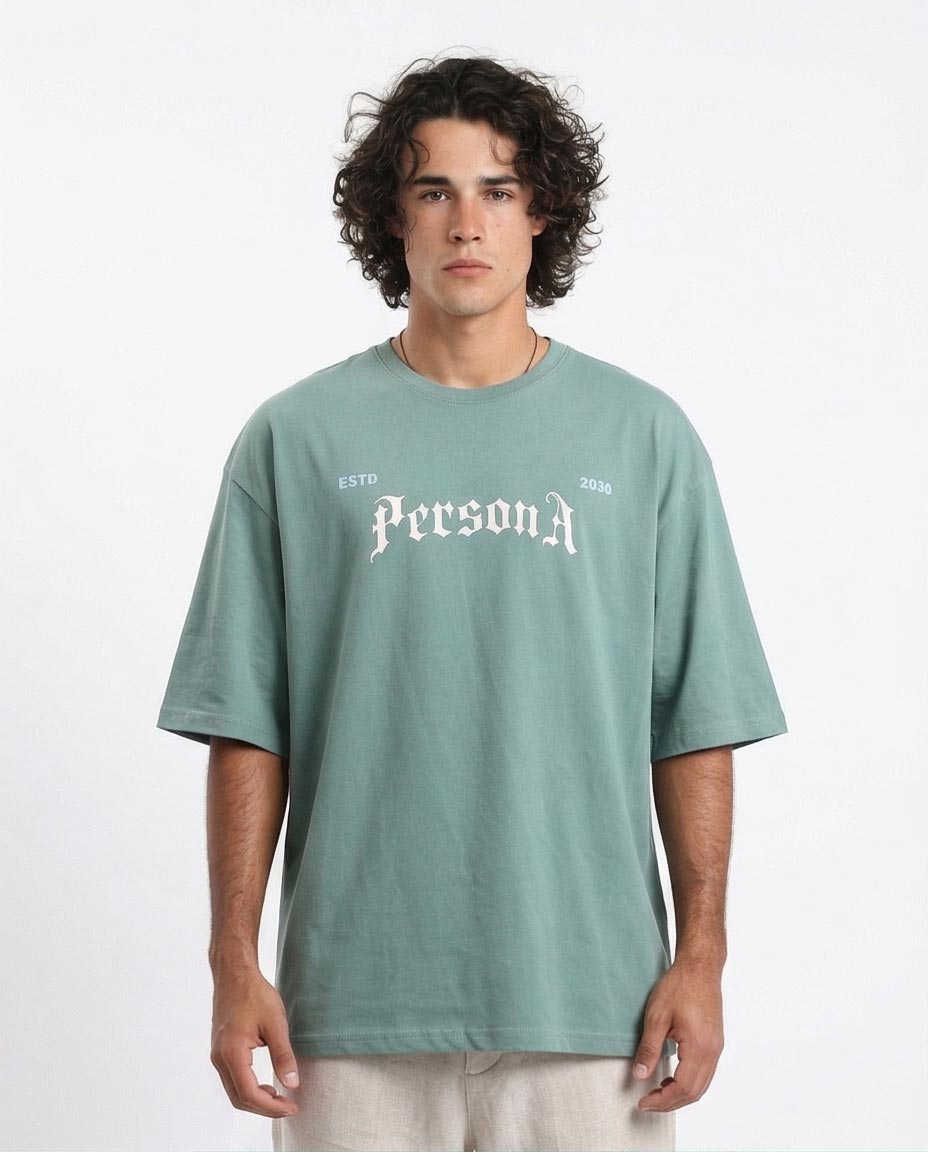 Man wearing a green t-shirt with 'PersonA' text on a white background
