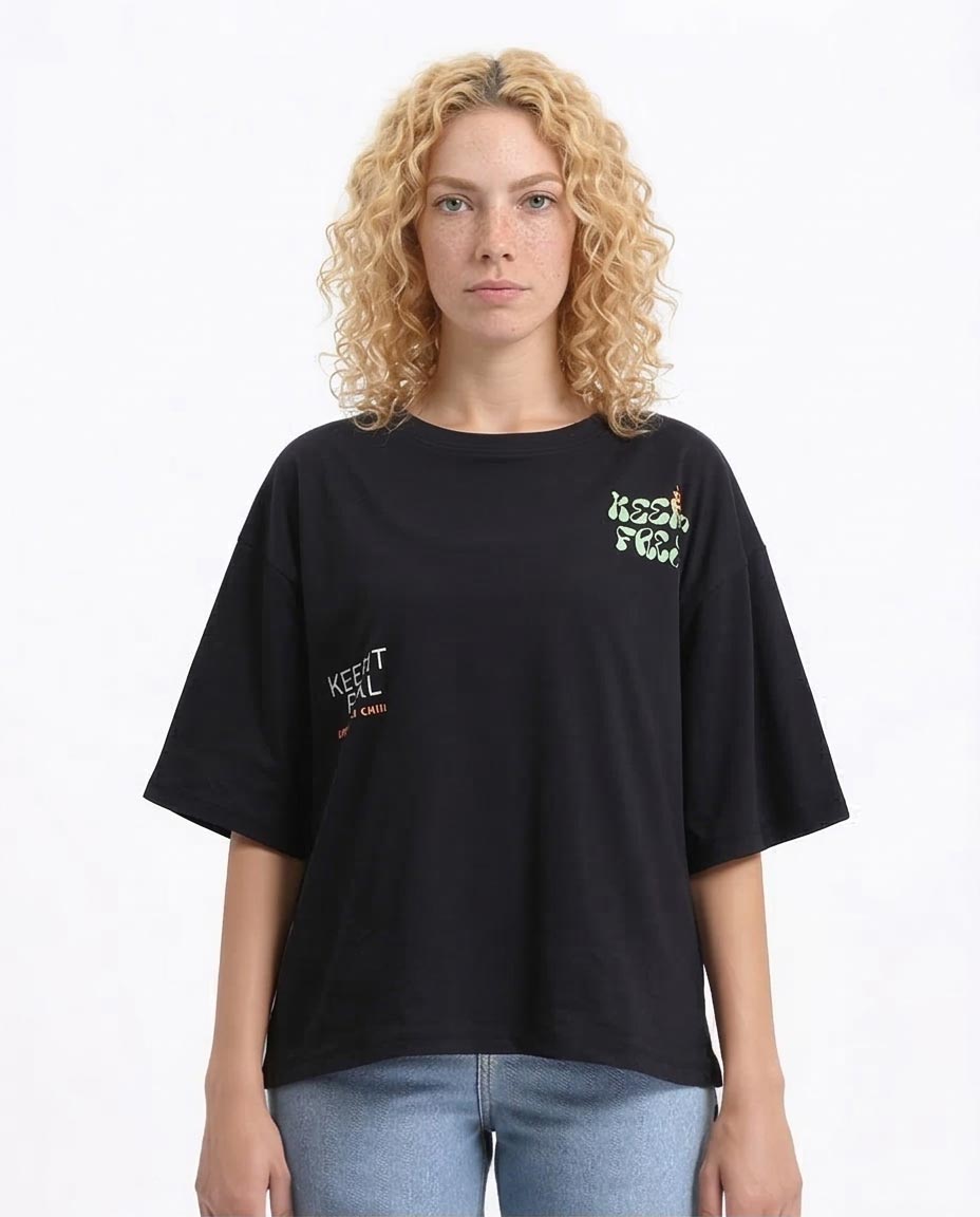 Woman wearing a black t-shirt with text on a white background