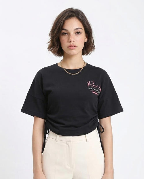 Woman wearing a black t-shirt with a logo on a white background