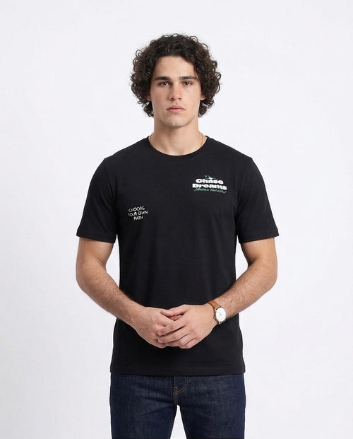 Man wearing a black t-shirt with text on a white background