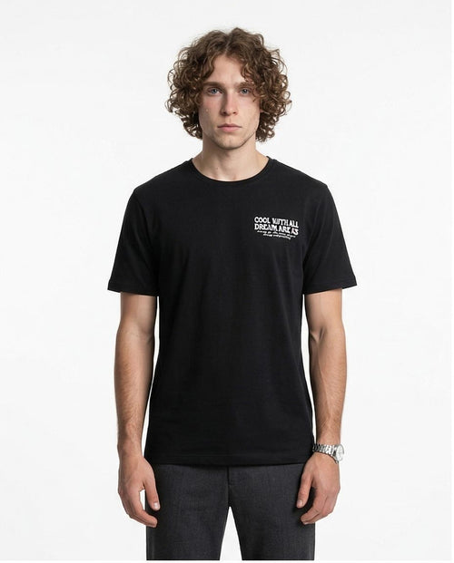 Man wearing a black t-shirt with text on a white background
