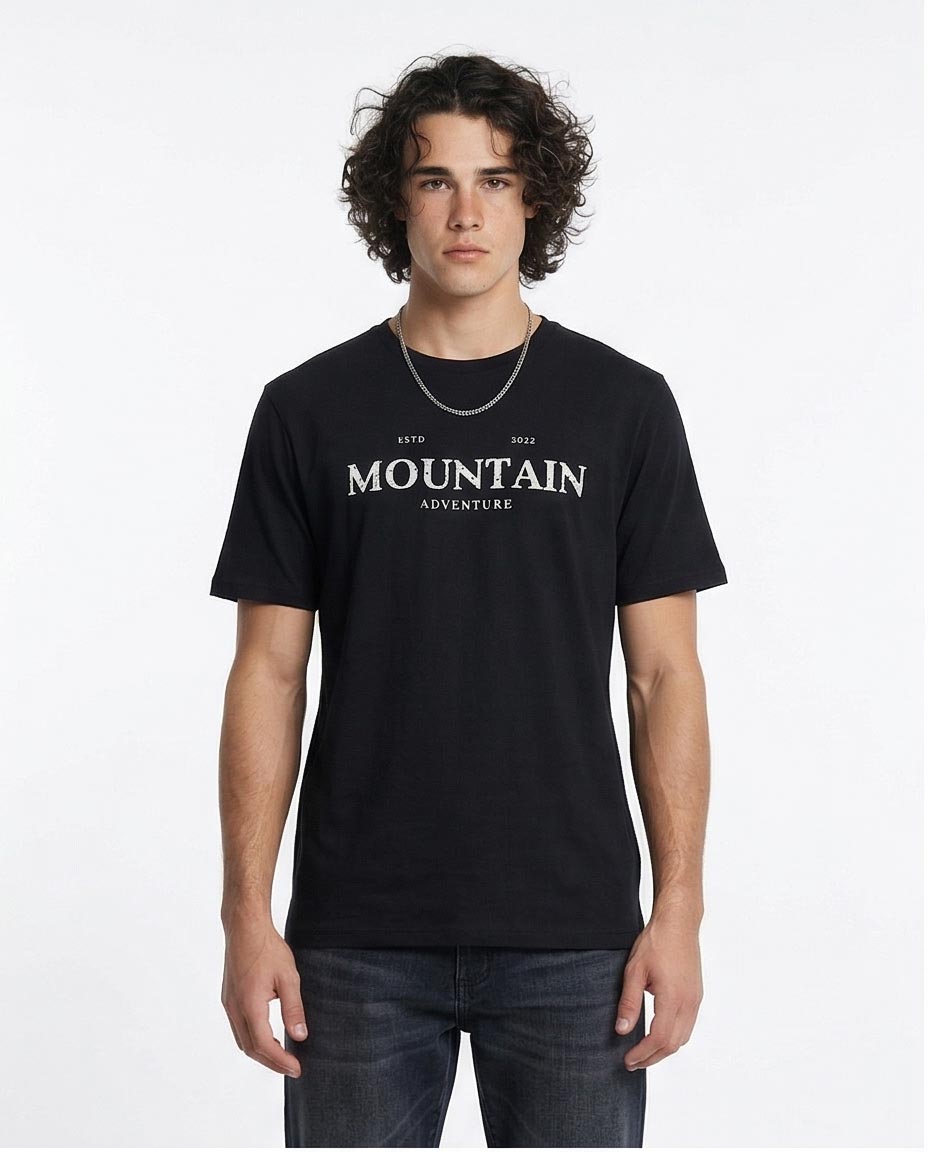 Man wearing a black t-shirt with 'Mountain Adventure' text on a white background