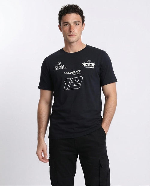 Man wearing a black t-shirt with logos and numbers on a white background