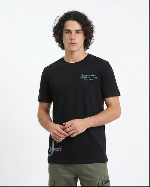 Person wearing a black t-shirt with text and graphics on a white background