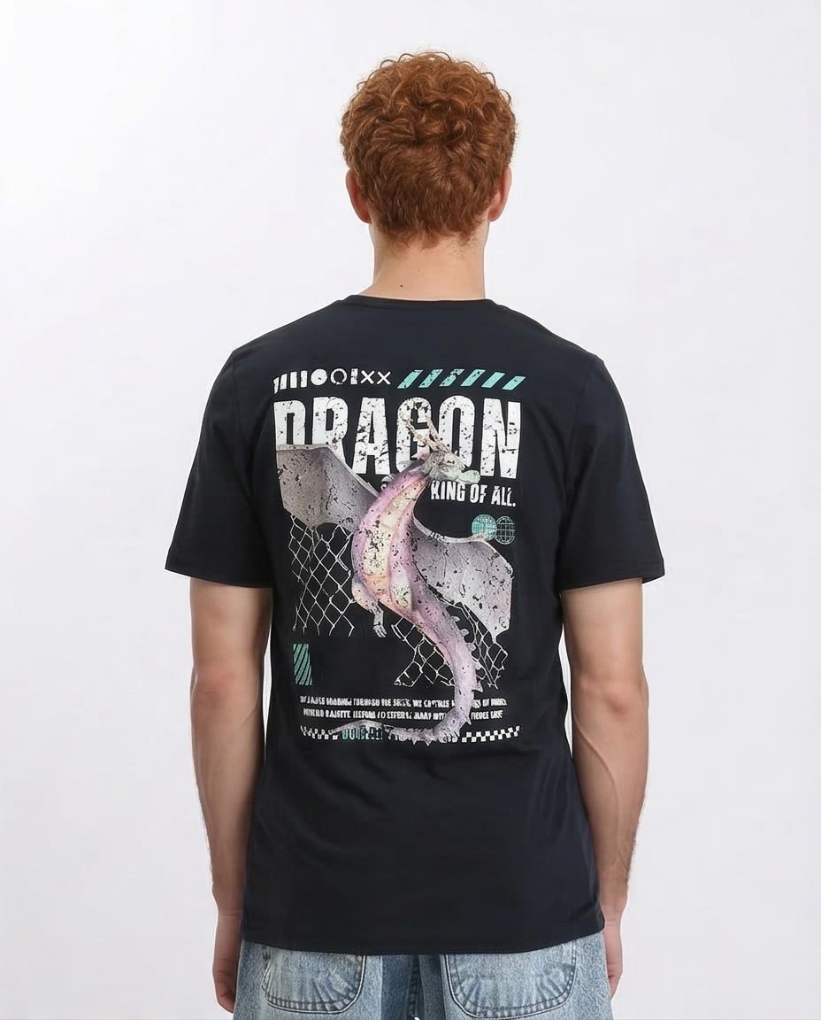 Person wearing a black t-shirt with a dragon design on the back, standing against a white background