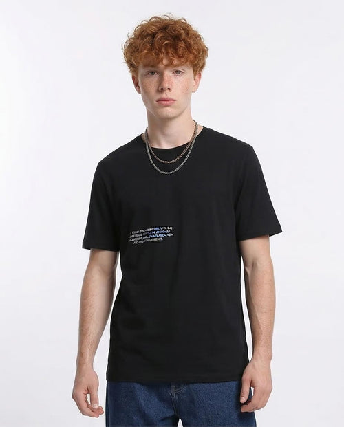Person wearing a black t-shirt with text on a white background