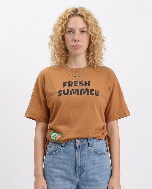 Woman wearing a brown 'Fresh Summer' t-shirt with a white background