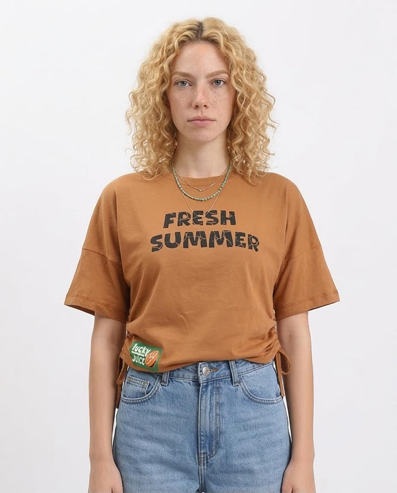 Woman wearing a brown 'Fresh Summer' t-shirt with a white background