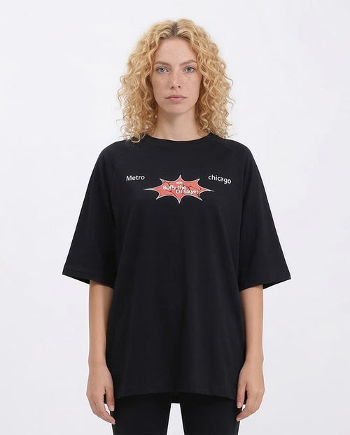 Person wearing a black t-shirt with 'Metro Chicago' logo on a white background