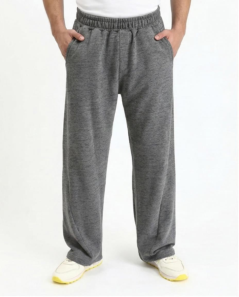 Gray sweatpants worn by a person on a white background