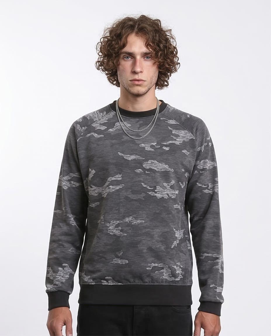 Man wearing a gray camouflage sweatshirt on a white background