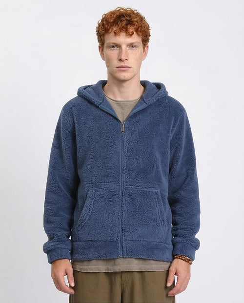 Person wearing a blue hoodie on a white background