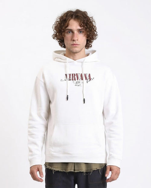 Person wearing a white hoodie with 'Nirvana' logo on a white background