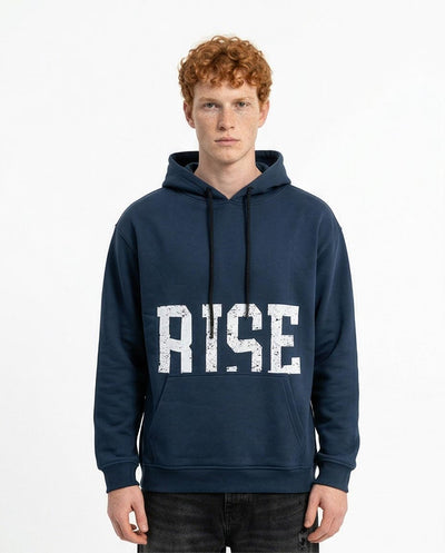 Person wearing a navy hoodie with 'RISE' printed on it against a white background