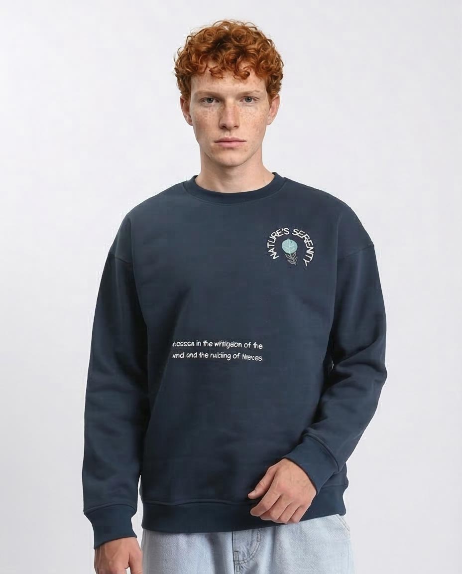 Man wearing a navy blue sweatshirt with text and logo on a white background