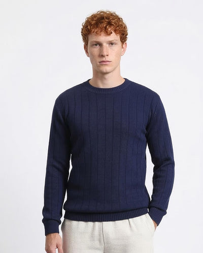 Man wearing a navy blue sweater on a white background