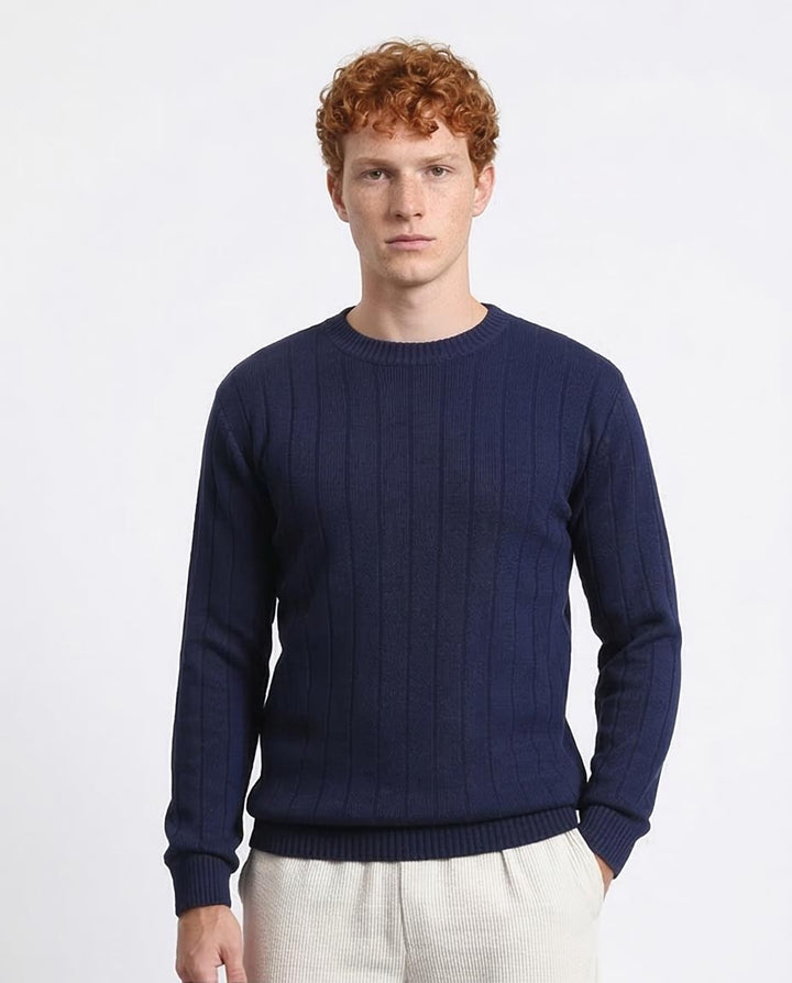 Man wearing a navy blue sweater on a white background
