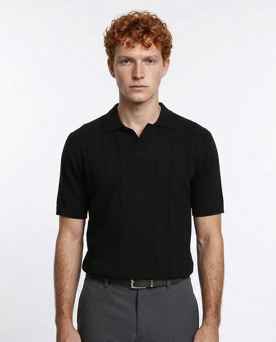 Man wearing a black polo shirt against a white background