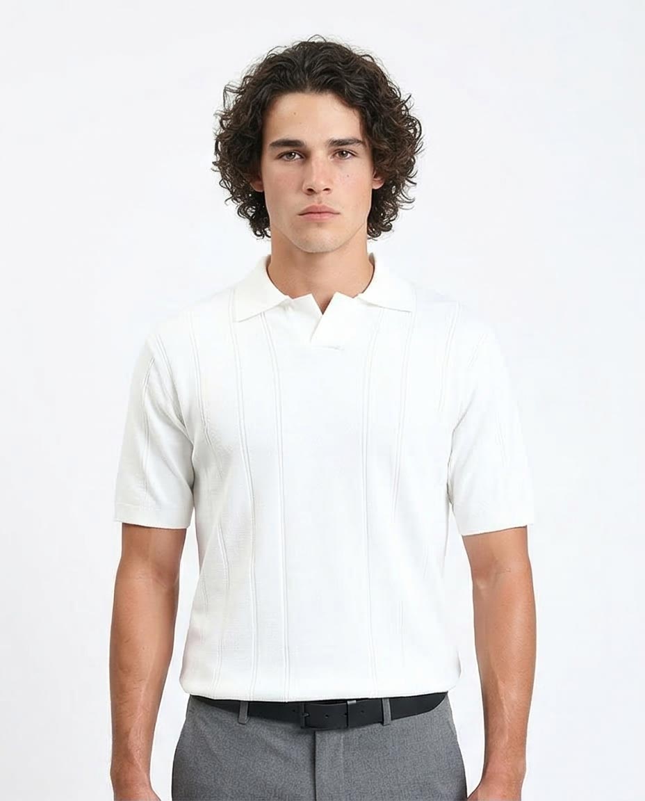 Man wearing a white short-sleeve shirt and gray pants on a light gray background