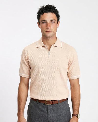 Man wearing a beige patterned polo shirt on a white background