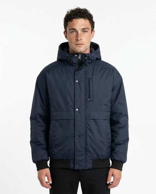 Man wearing a navy blue jacket on a white background