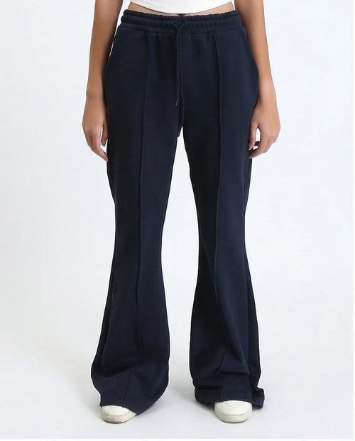 Navy blue wide-leg pants worn by a person on a white background