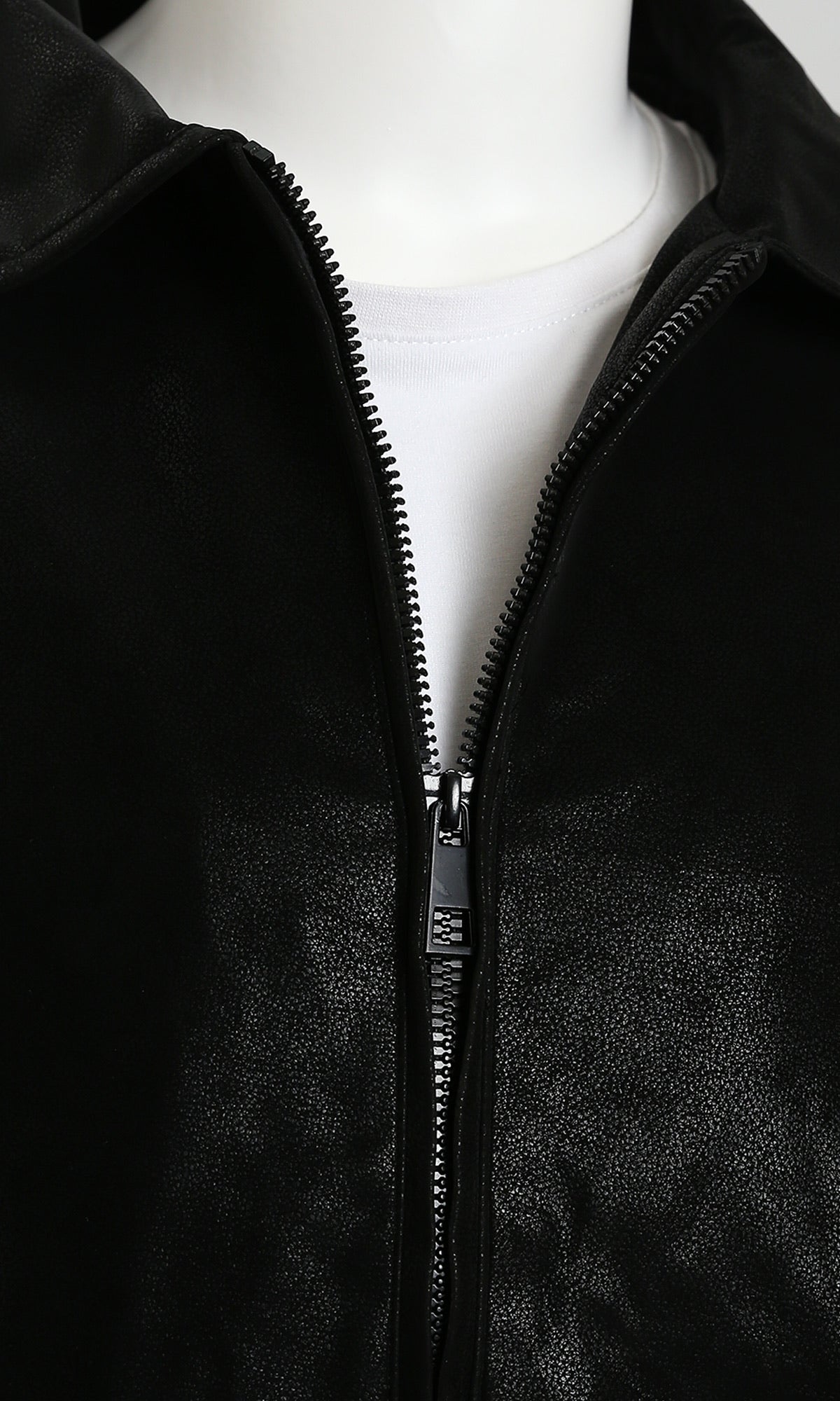 Black jacket with a zipper on a mannequin against a white background