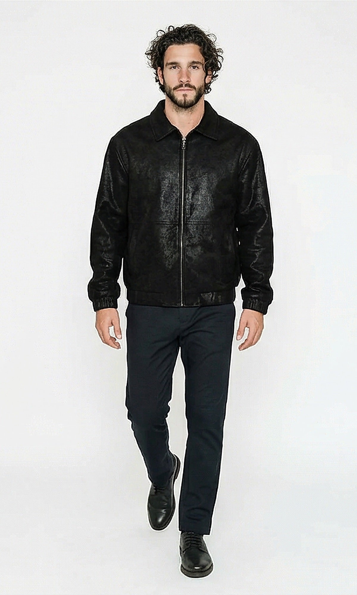 Man wearing a black leather jacket on a white background