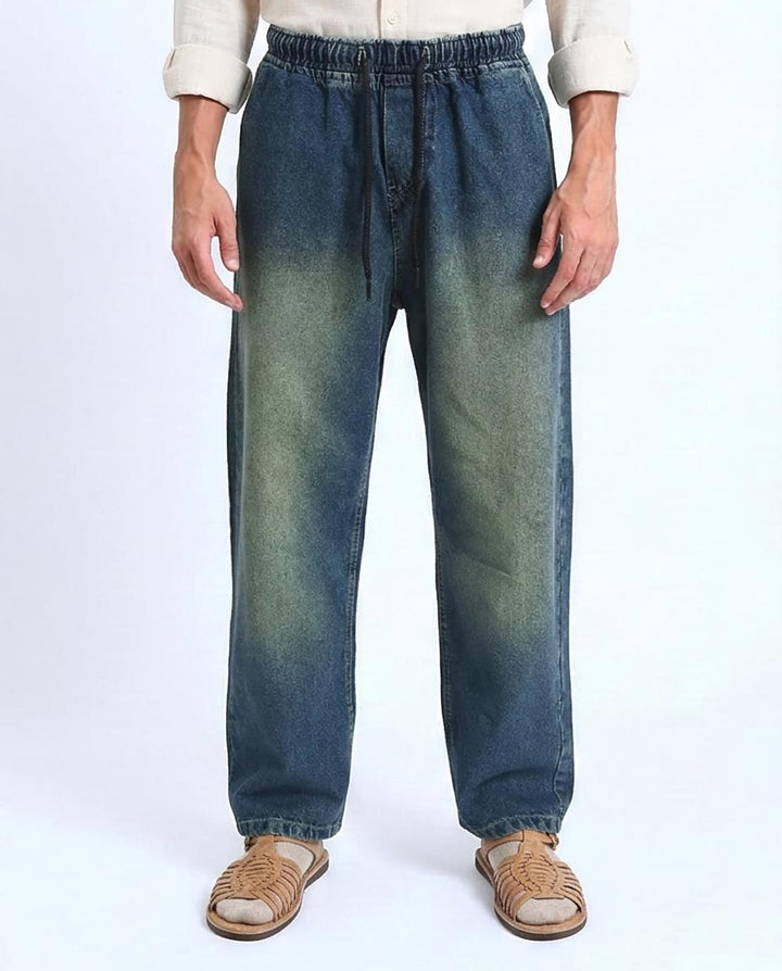 Person wearing blue jeans on a white background