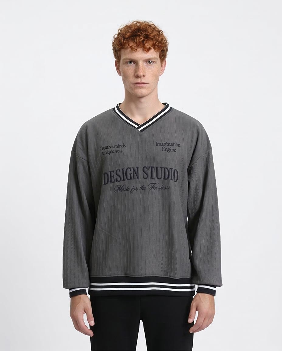 Man wearing a gray sweatshirt with text on a white background