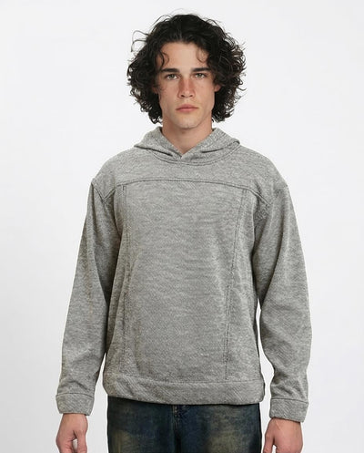 Man wearing a gray hoodie on a white background