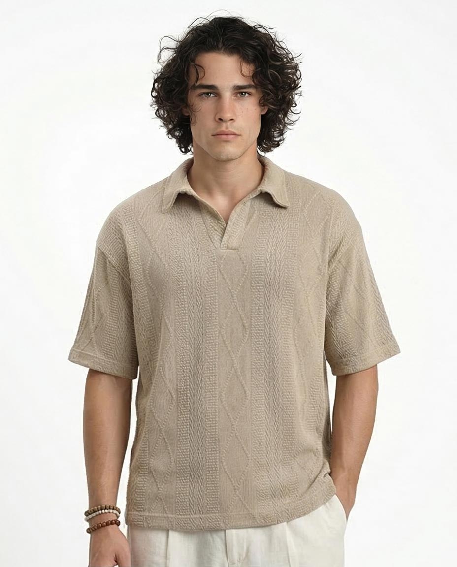 Man wearing a beige textured shirt on a white background