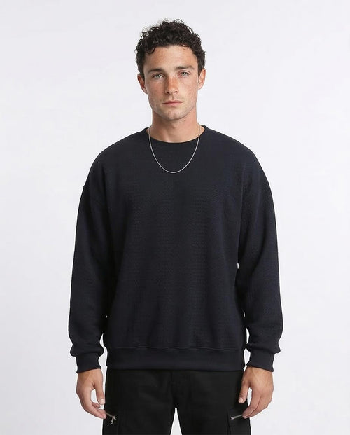Man wearing a black sweatshirt on a white background