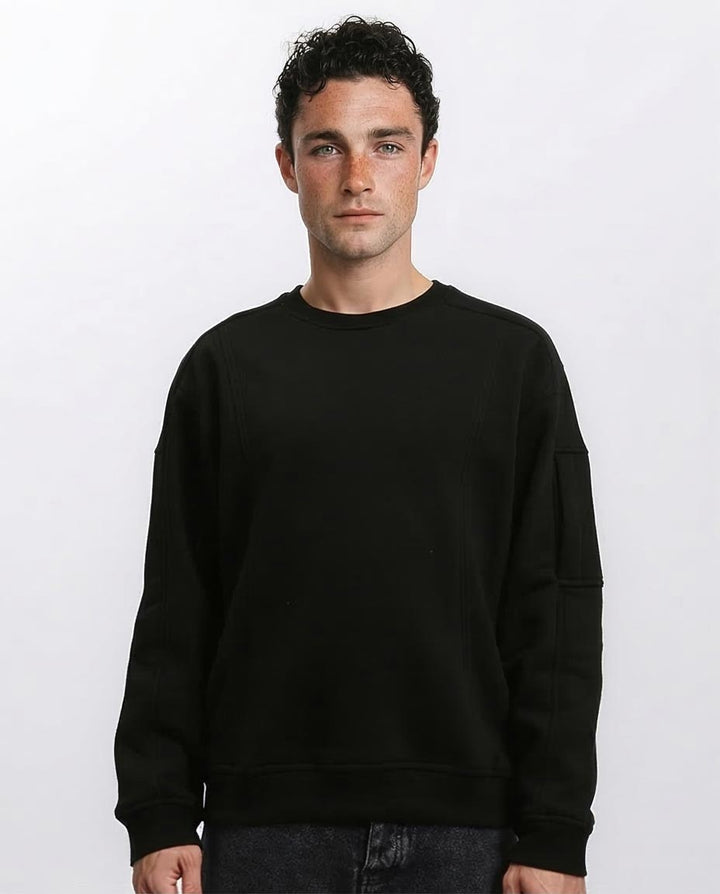 Man wearing a black sweatshirt against a white background