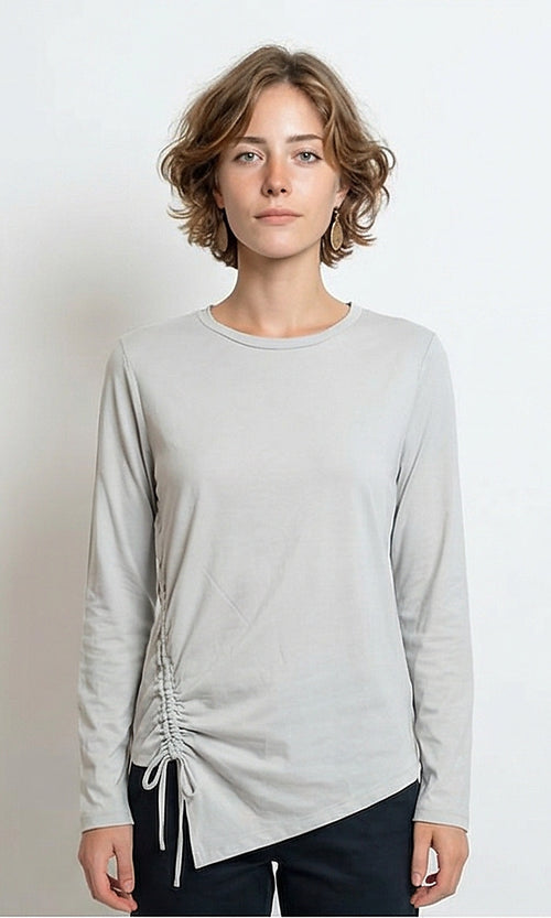 Ravin grey asymmetrical ruched long-sleeve tee on model - front view.