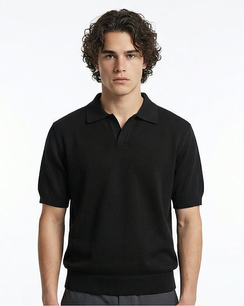 Man wearing a black polo shirt against a white background